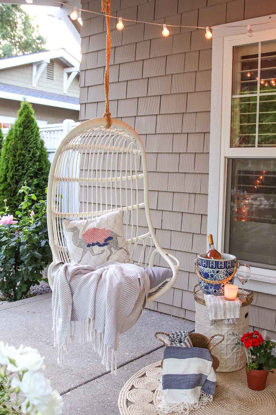 outdoor entertaining. front porch swing. summer front porch decor. summer front porch decorating