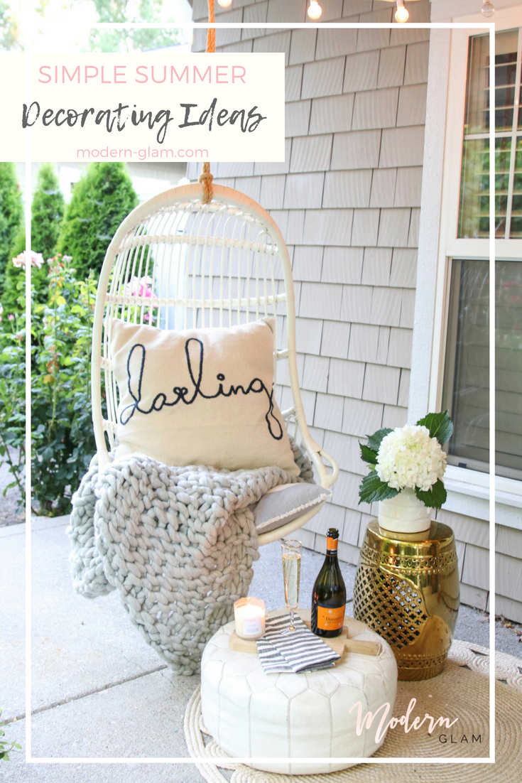 front porch swing with pillow and flowers