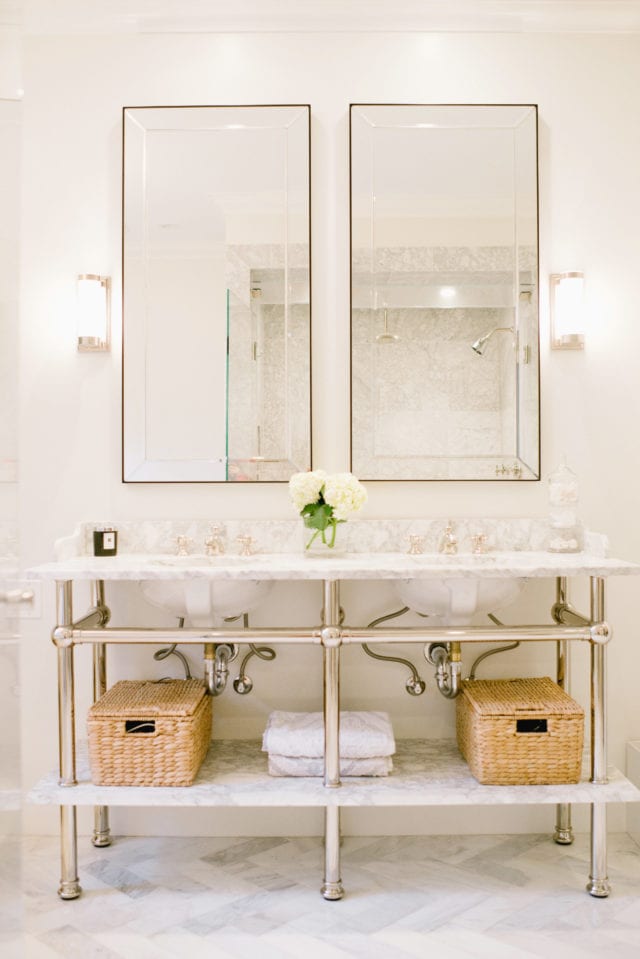 marble bathroom with apothecary sink