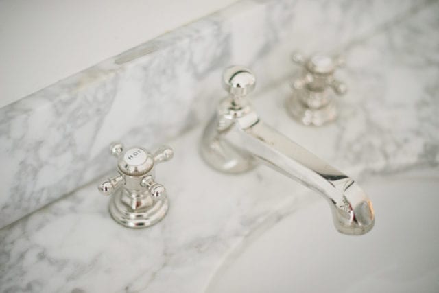 marble countertop with polished nickel fixture