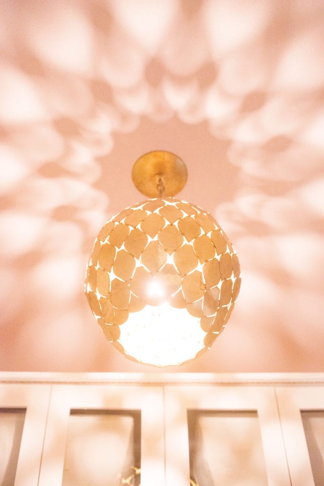 light fixture with pink ceiling