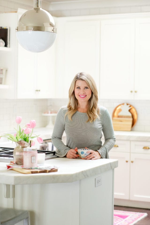 white kitchen with pink tulips