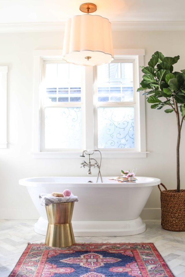 marble bathroom with herringbone tile