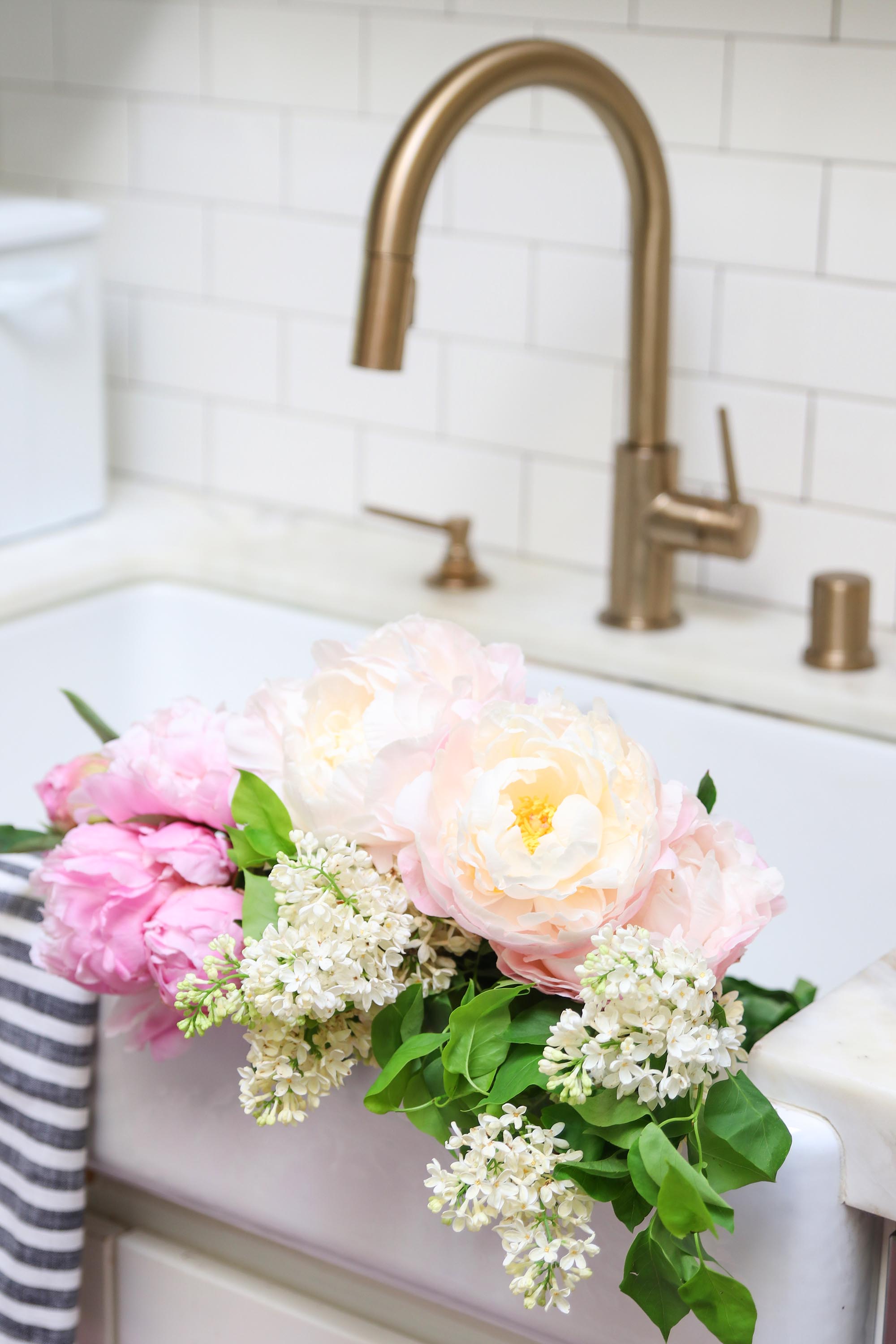 peonies in kitchen sink