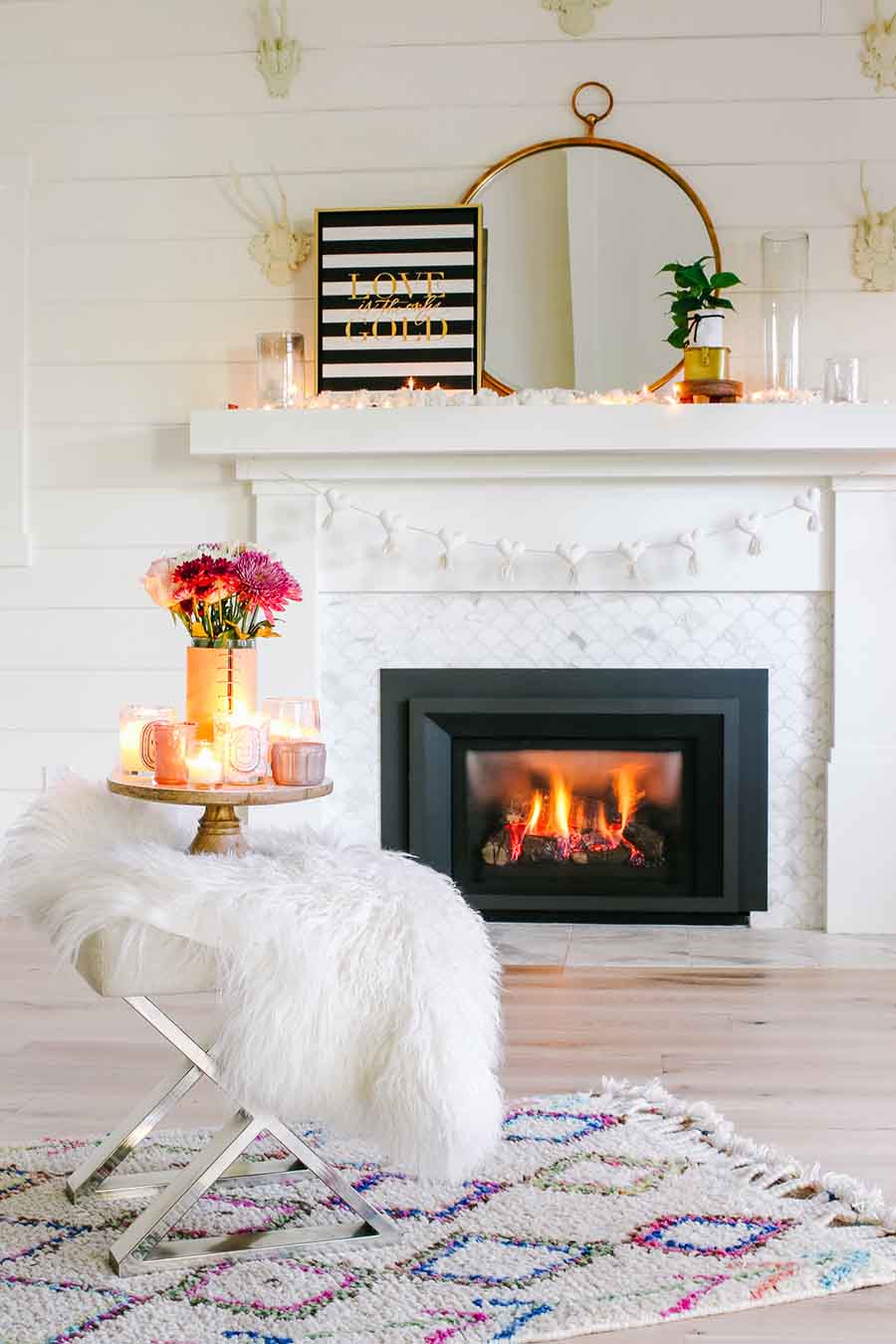 candles and cake stand in white room