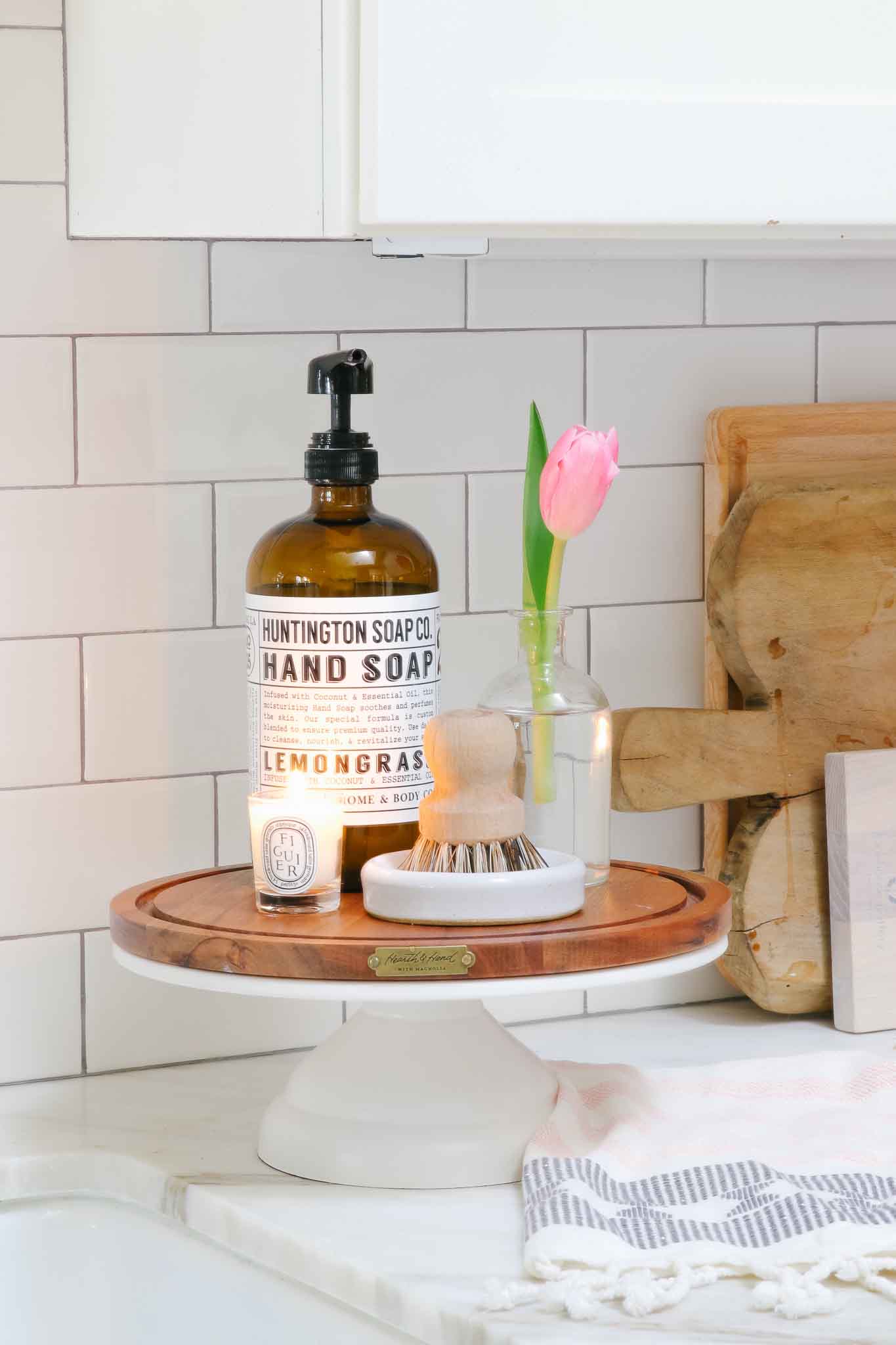 cake stand by kitchen sink