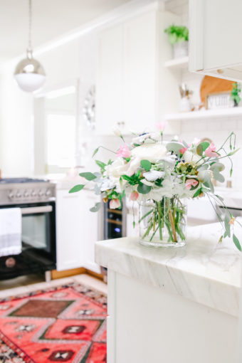 white kitchen with vintage rug