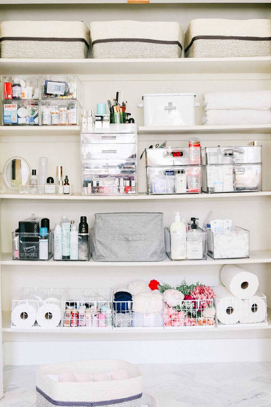 linen closet with baskets