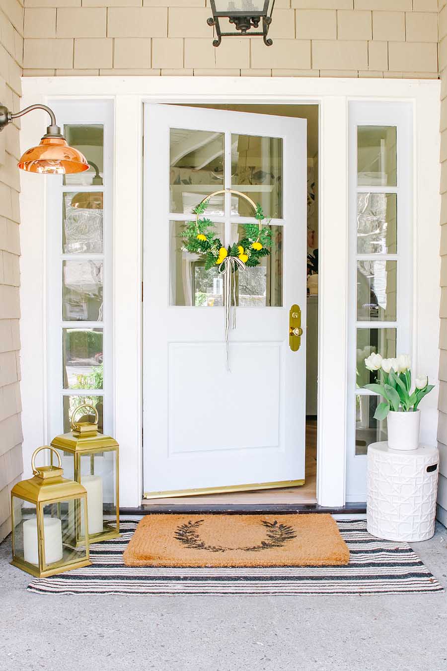 Front porch with blue door and lemon wreath