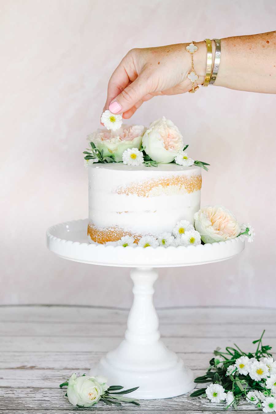 naked cake with fresh flowers