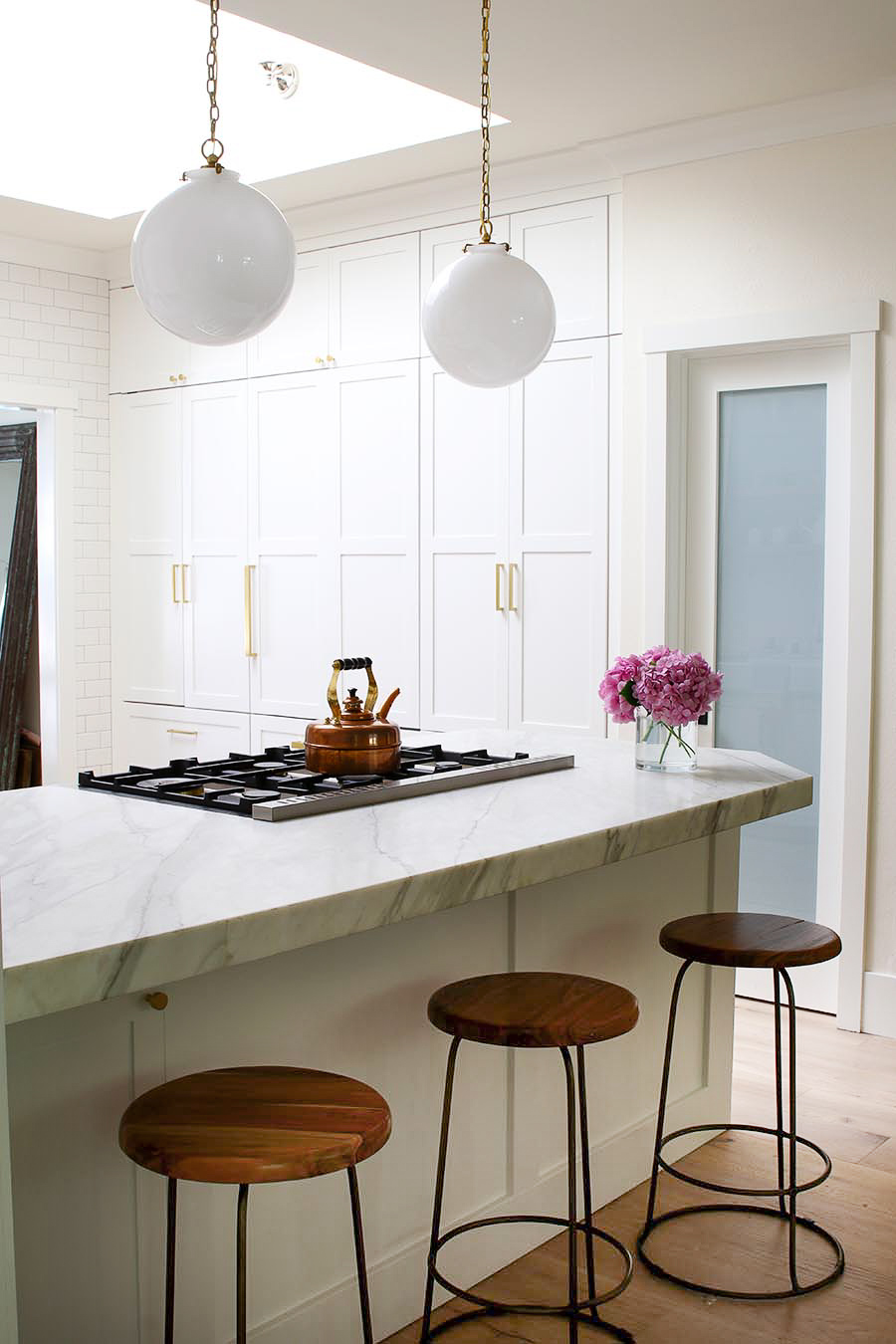 integrated appliances in white kitchen