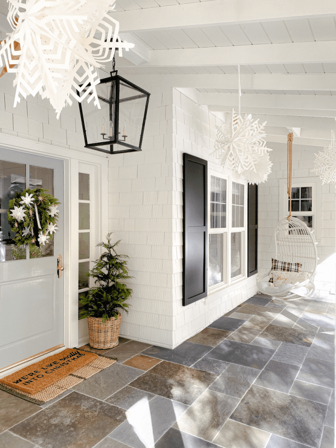 hanging paper lanterns on holiday porch