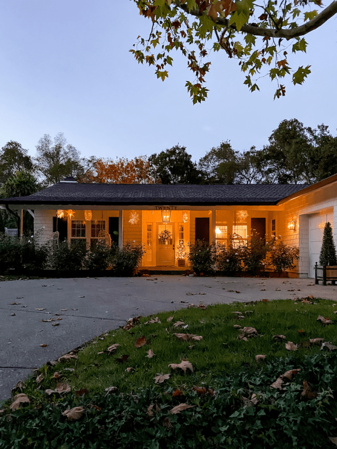 scandinavian inspired christmas porch with hanging lanterns