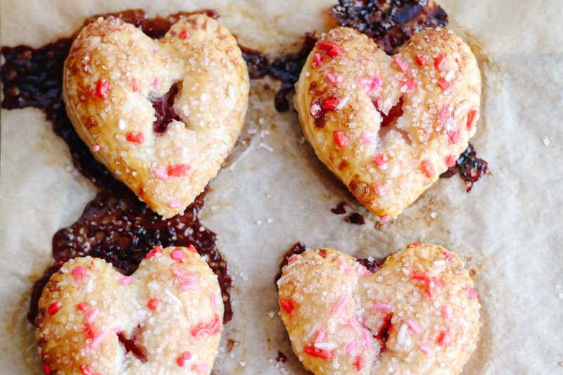 Heart Shaped Raspberry Hand Pies For Valentines Day - Modern Glam